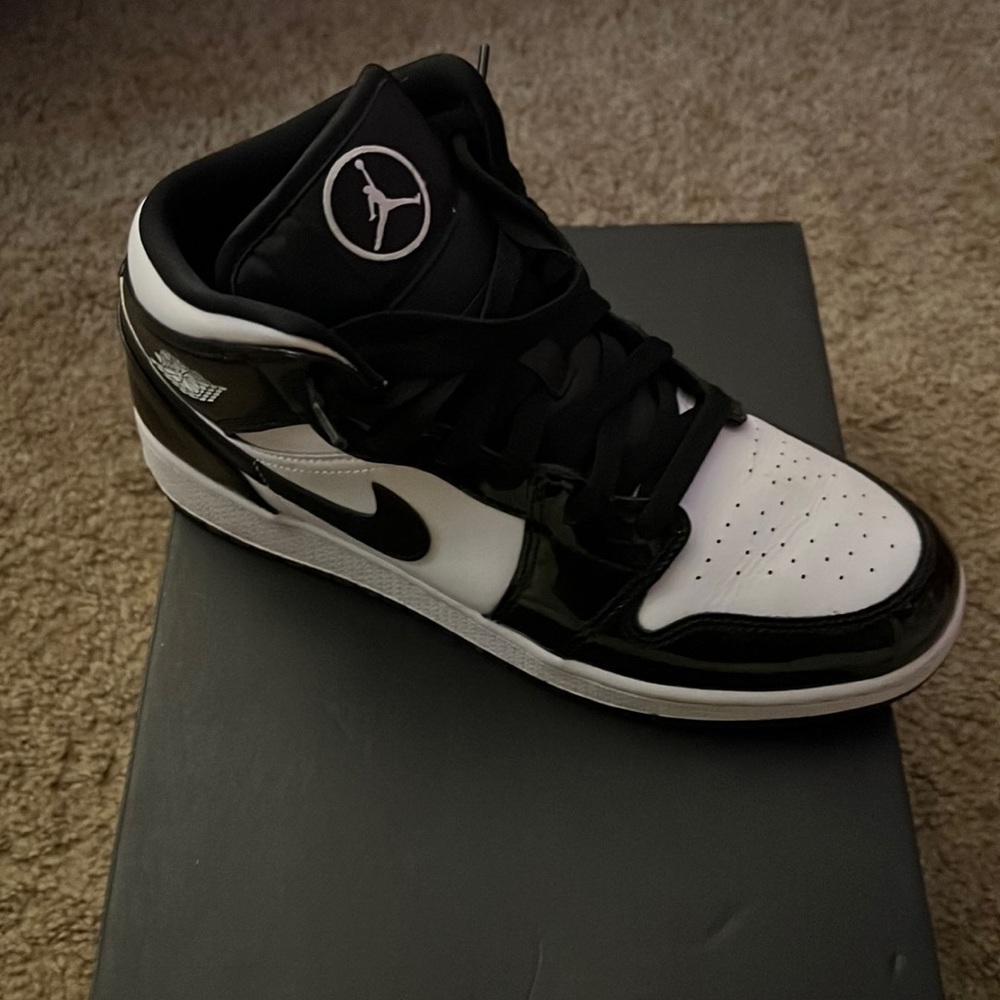Women’s size 8.5 or kids 7 jordan mid black white patent leather trim